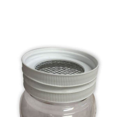 Double jar Varroa mite test with screened lid separating bees from mites