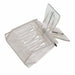 Plastic queen clip holding a queen on the comb
