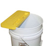 Portable uncapping bench clamped on a 5-gallon bucket rim with frame rest